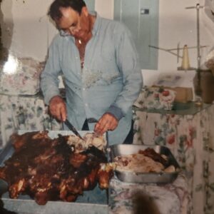 Dad Slicing up the Goods-Noche Buena-2003